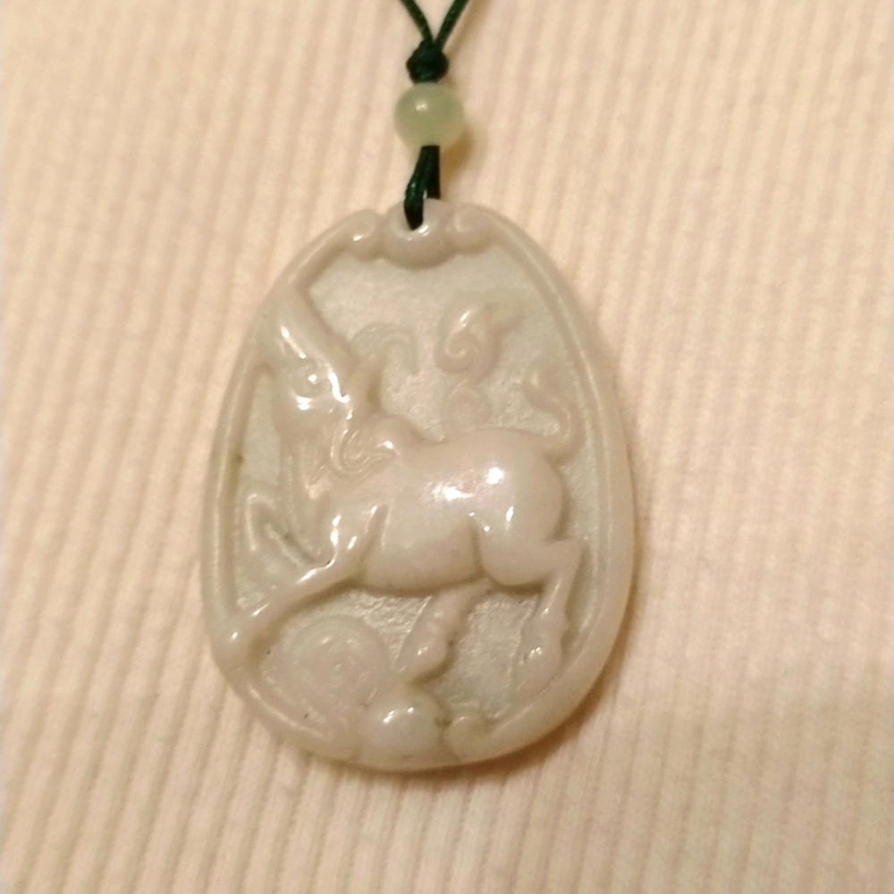 Amazing! bull carved in to a nice piece of White Jade with choker